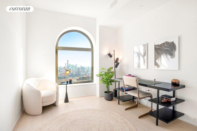 living area featuring a view of city and visible vents