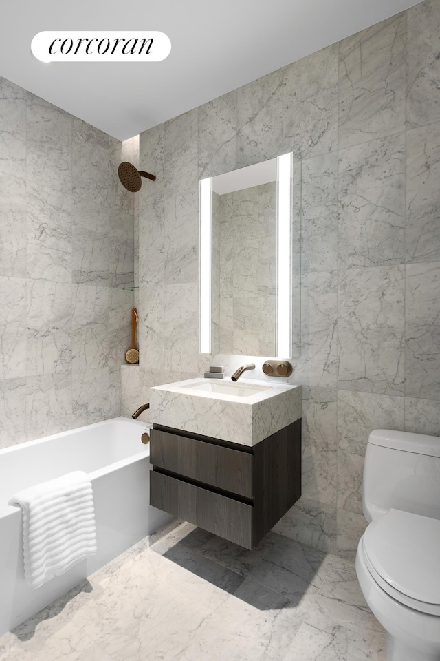 full bathroom with toilet, marble finish floor, vanity, stone wall, and tile walls