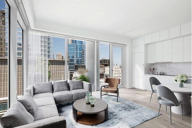 living area featuring light wood-style flooring and a view of city