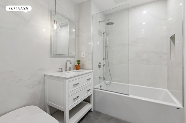 bathroom with shower / tub combination, toilet, visible vents, vanity, and tile walls