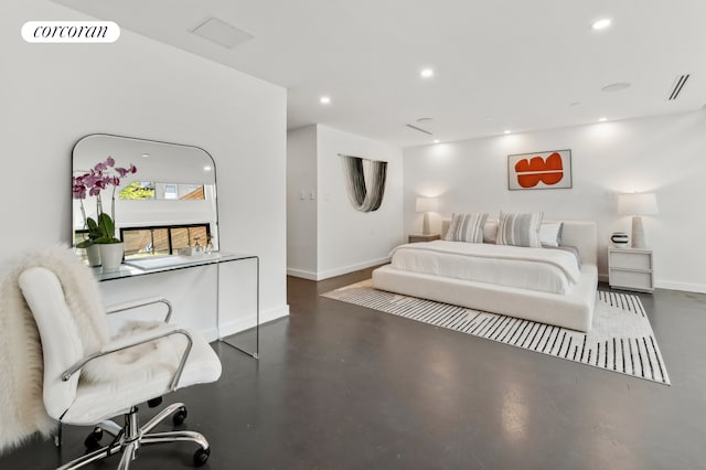 bedroom with concrete flooring, recessed lighting, visible vents, and baseboards