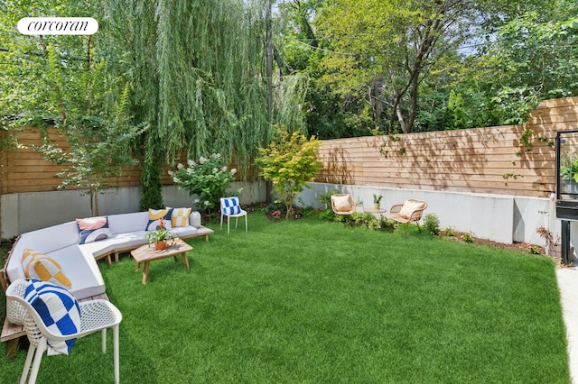 view of yard featuring outdoor lounge area and a fenced backyard