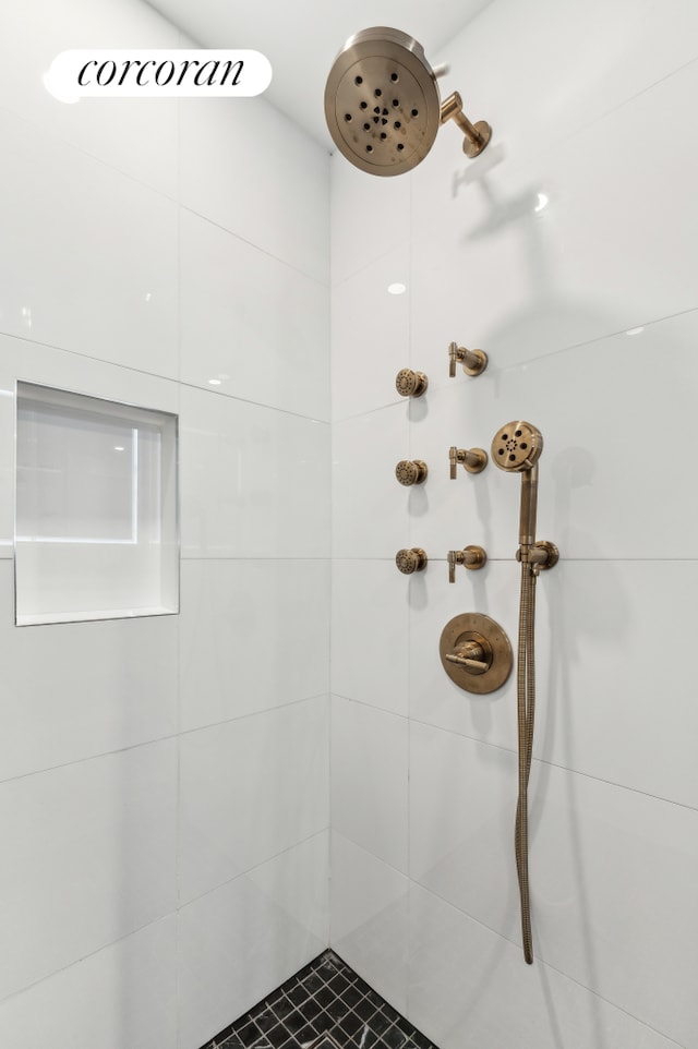 full bathroom with a tile shower