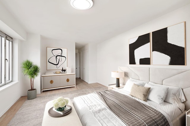 bedroom with light wood-type flooring