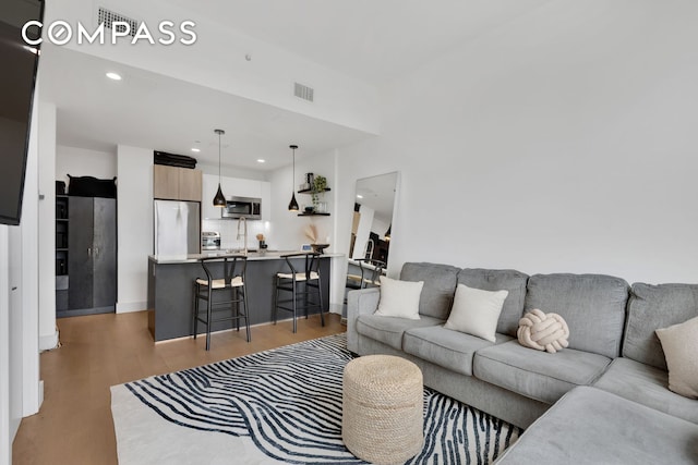1325 Herkimer St Unit 404, New York City, NY 11233 - living area featuring light wood-type flooring and recessed lighting