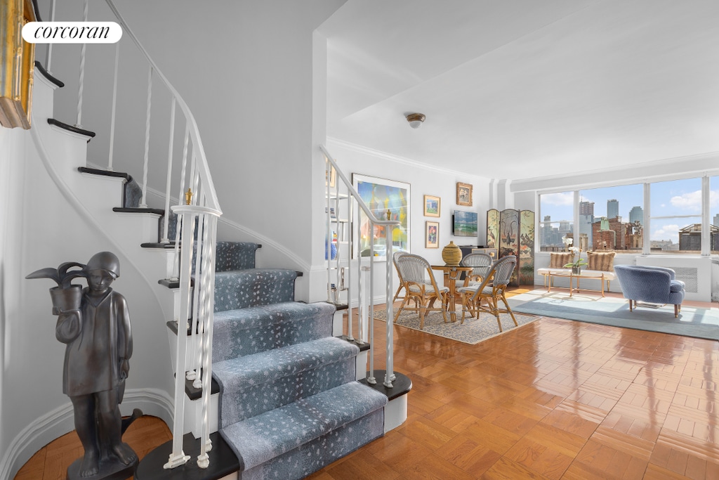 stairs featuring parquet floors