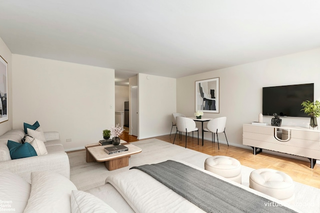 139 E 33rd St Unit 2C, New York City, NY 10016 - living room featuring baseboards