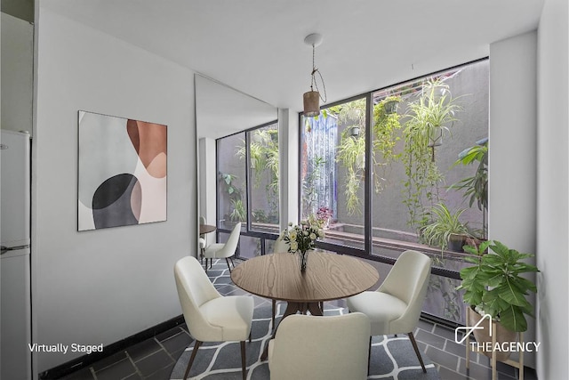 dining room featuring a wall of windows