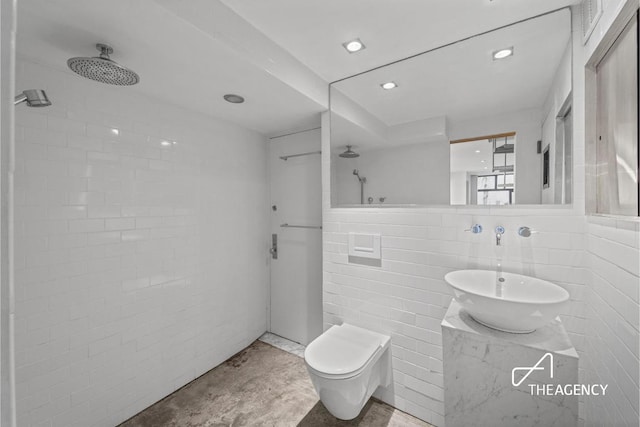 bathroom with a shower, toilet, and concrete floors