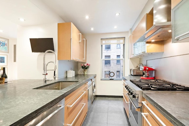 kitchen featuring extractor fan, recessed lighting, a sink, appliances with stainless steel finishes, and dark countertops