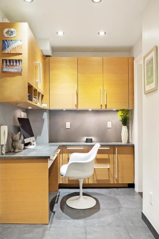 home office featuring concrete flooring and recessed lighting