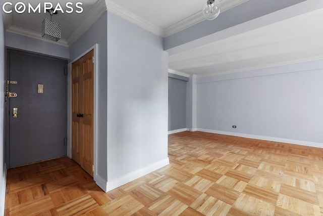 interior space featuring ornamental molding and light parquet flooring