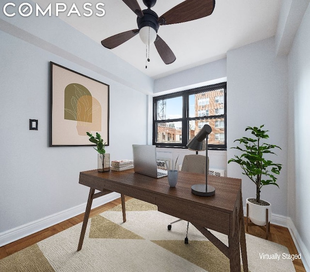 home office featuring ceiling fan and hardwood / wood-style flooring