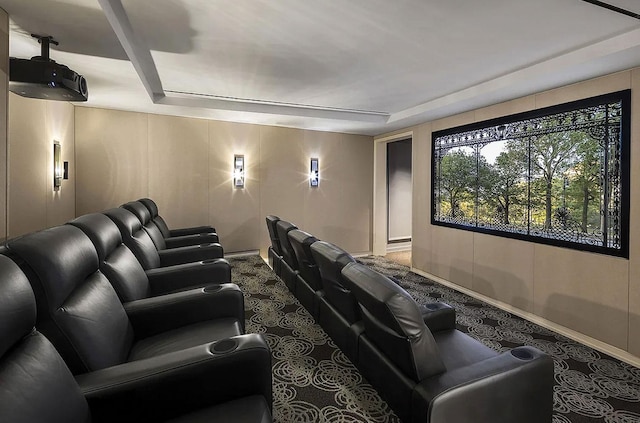 cinema room with carpet floors and baseboards