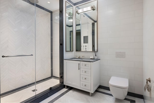 full bath with toilet, a stall shower, tile walls, and vanity