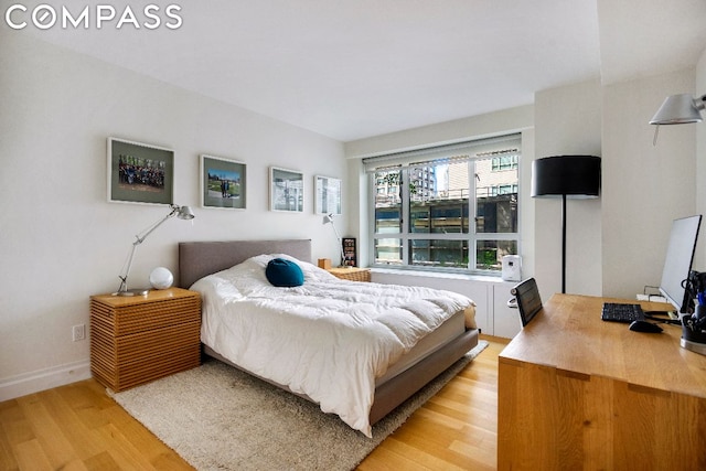 bedroom with light wood-type flooring