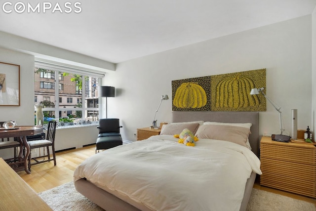 bedroom with light hardwood / wood-style flooring