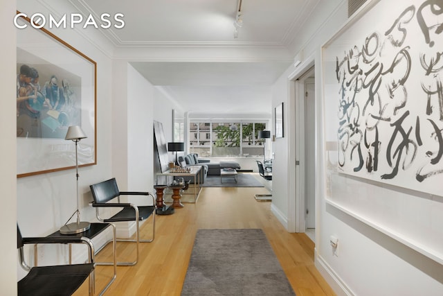 200 E 66th St Unit B205, New York City, NY 10065 - corridor with wood finished floors, rail lighting, and crown molding