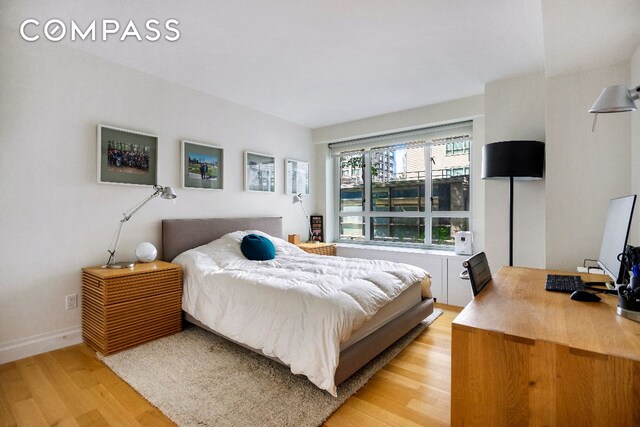 bedroom with light wood-type flooring