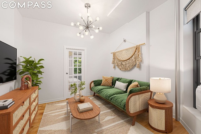 living room featuring an inviting chandelier and light hardwood / wood-style flooring