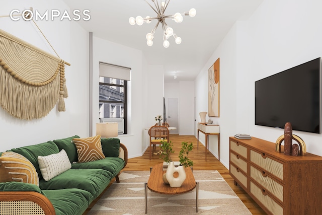 28 Perry St Unit 4E, New York City, NY 10014 - living area with wood finished floors, a chandelier, and baseboards