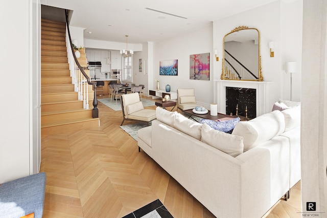 living room featuring stairs