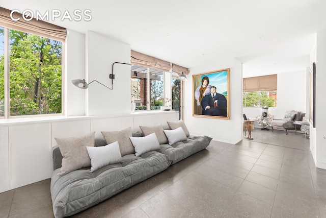 350 E 82nd St Unit 14Ab, New York City, NY 10028 - living room featuring plenty of natural light and tile patterned floors