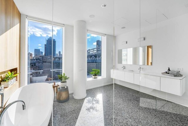 full bathroom featuring vanity, shower / bathtub combination with curtain, and toilet