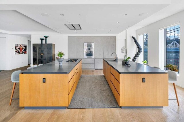 dining room with hardwood / wood-style floors and a notable chandelier