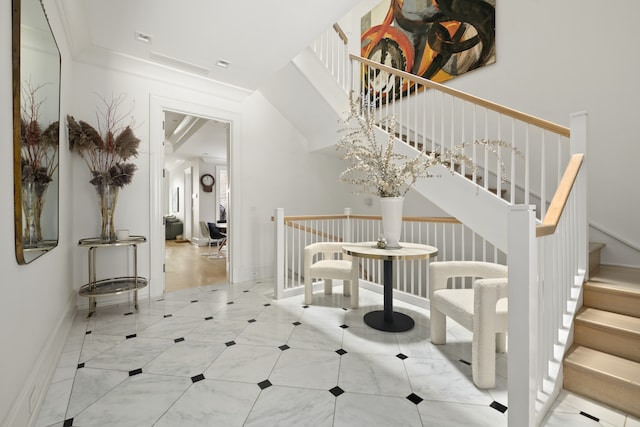 staircase featuring baseboards