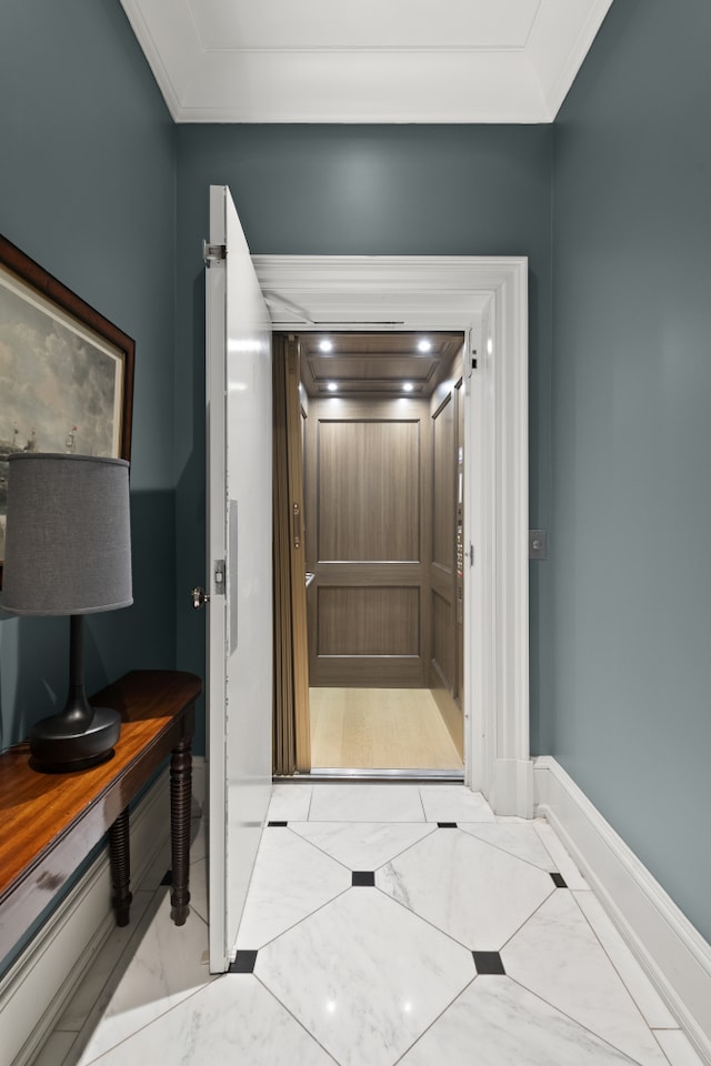 bathroom with marble finish floor, baseboards, and ornamental molding