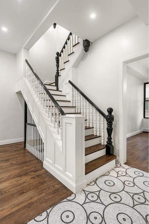 stairway featuring hardwood / wood-style flooring