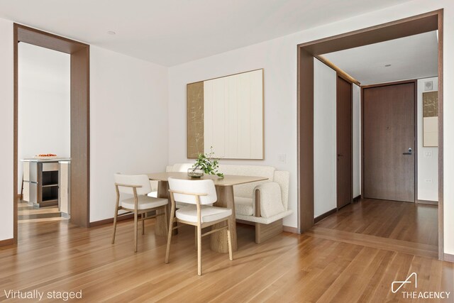 dining room with hardwood / wood-style floors and breakfast area