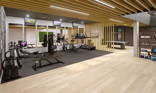 exercise room featuring wood finished floors