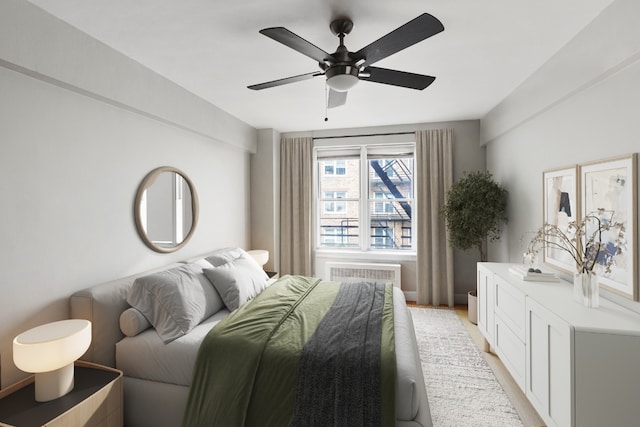 bedroom featuring light hardwood / wood-style flooring and ceiling fan