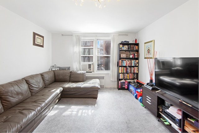 living room featuring carpet flooring, radiator, cooling unit, and a chandelier