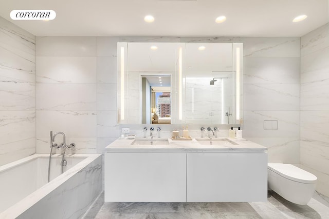 bathroom with toilet, double vanity, a sink, and visible vents