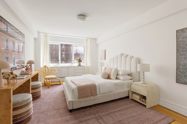 bedroom featuring wood finished floors