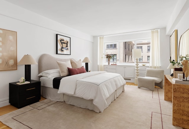 bedroom with light hardwood / wood-style flooring