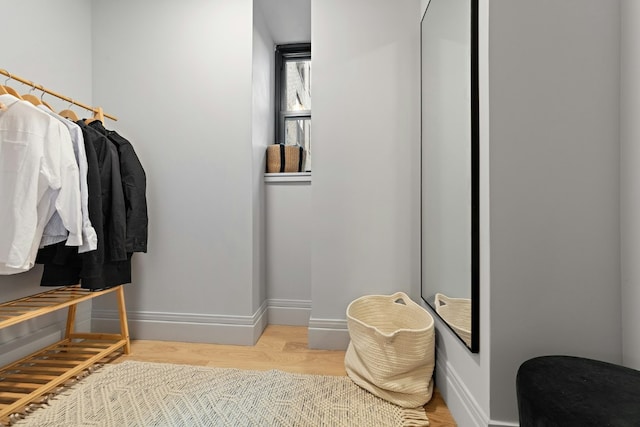 walk in closet featuring light hardwood / wood-style flooring