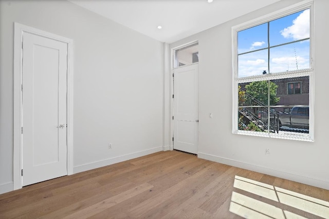 spare room with light wood-type flooring