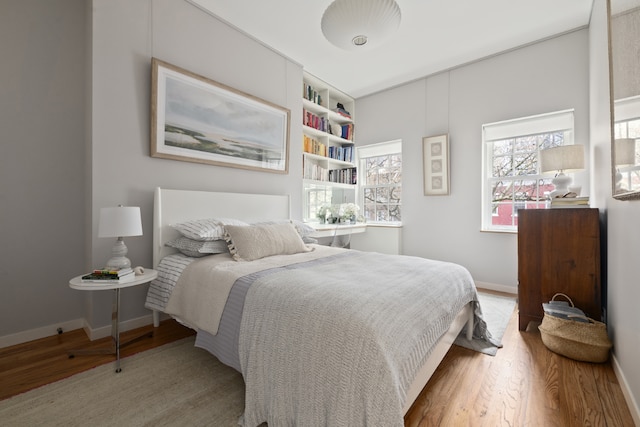 bedroom with light hardwood / wood-style flooring