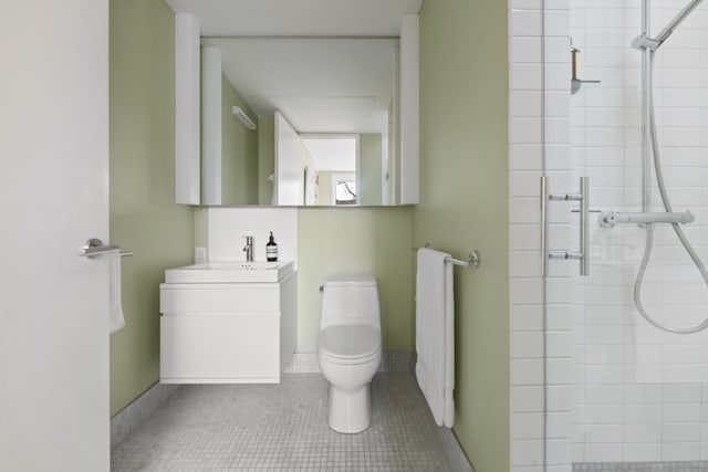 bathroom with radiator heating unit, vanity, toilet, a shower with door, and tile patterned floors