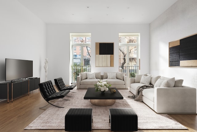 living room with a brick fireplace, beamed ceiling, and light wood-type flooring