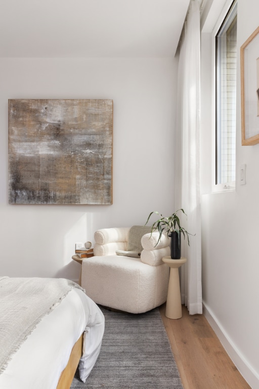 bedroom with wood-type flooring