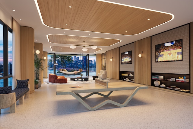 lobby with a wall of windows and wood ceiling