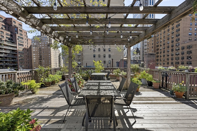 325 E 80th St Unit 4H, New York City, NY 10075 - deck featuring outdoor dining area, a pergola, and a view of city