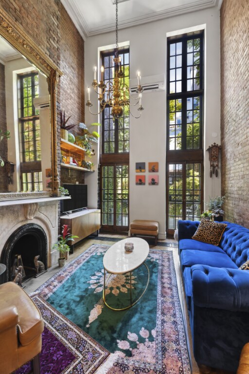 staircase featuring brick wall and hardwood / wood-style flooring