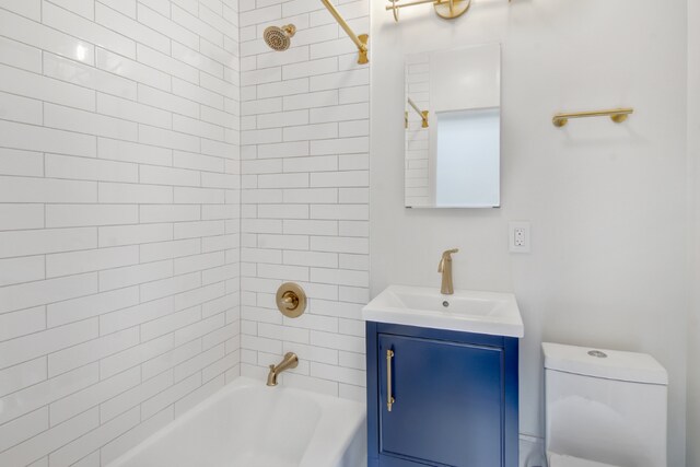 bathroom featuring toilet, tile walls, and sink