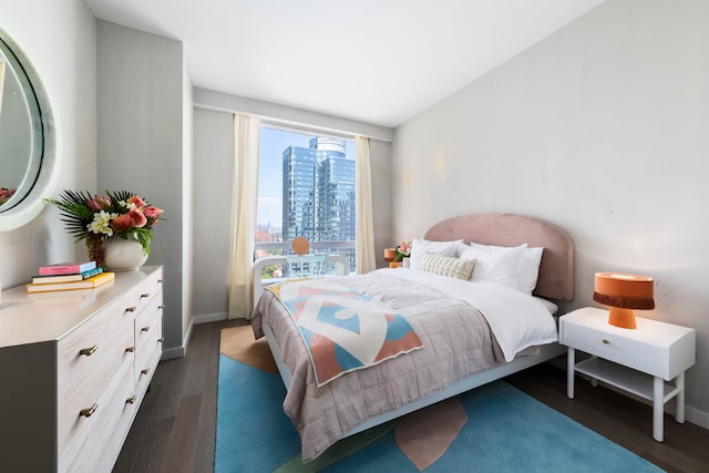 bedroom featuring dark wood-type flooring